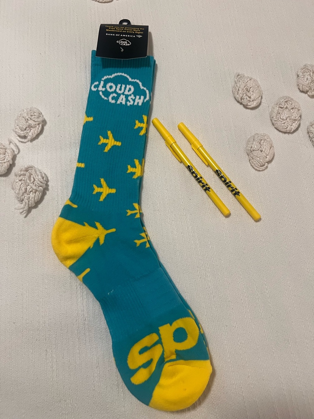 Spirit Airlines UNISEX yellow plane socks and 2 pens.  Collectibles